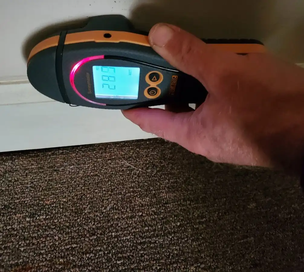 Moisture detection at baseboard during Storm Damage Restoration in Brookfield